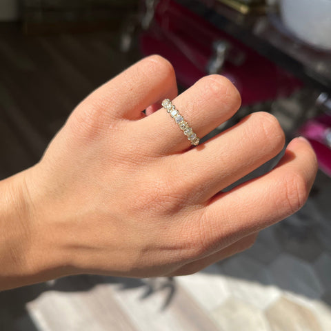Elegant 1.07ctw Old Mine Cut Diamond Half-Hoop Band, romantic design with Old Mine Cut Diamonds, Earth-mined diamonds in yellow gold shown on ring finger