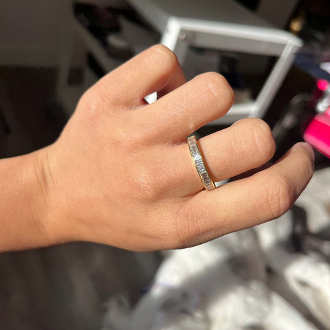Elegant 1.10ctw Baguette Cut Diamond Channel Set Band, romantic design with Baguette Cut Diamonds, Earth-mined diamonds in yellow gold shown on ring finger