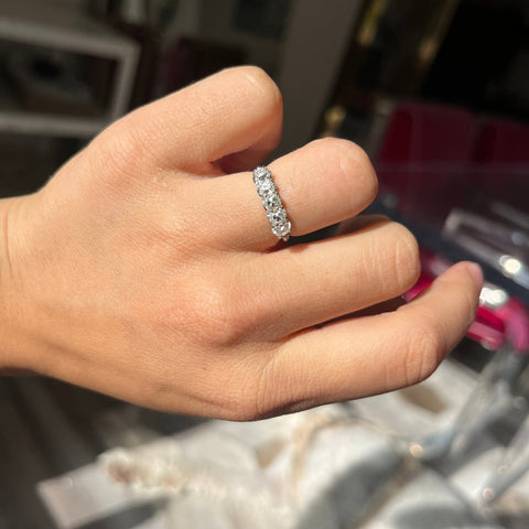 Elegant 1.11ctw Old Mine Cut Diamond 5-Stone Half-Hoop Band, romantic design with Old Mine Cut Diamonds, Earth-mined diamonds in platinum shown on ring finger