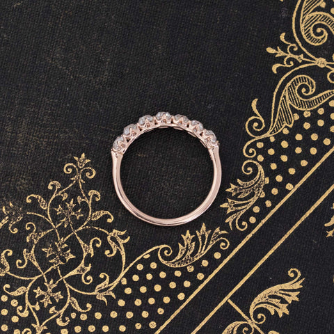 Side view of 1.11ctw Old Mine Cut Diamond 7-Stone Half-Hoop Band, vintage-inspired band with Old Mine Cut Diamonds, crafted in rose gold