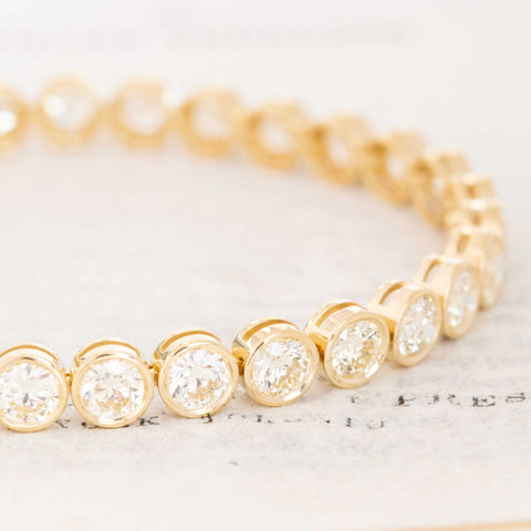 Close-up of bezel-set Old European Cut diamonds in the 11.44ctw Tennis Bracelet, showcasing fiery antique faceting and vintage brilliance.