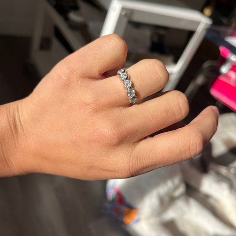 Elegant 1.14ctw Old European Cut Diamond 5-Stone Bezel Band, romantic design with Old European Cut Diamonds, Earth-mined diamonds in platinum shown on ring finger