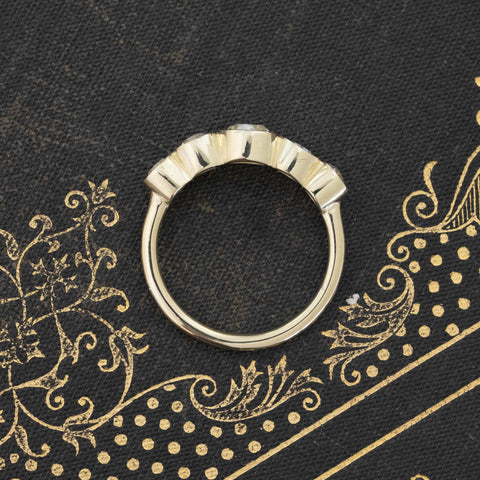 Side view of 1.16ctw Old European Cut Diamond Graduated 5-Stone Band, vintage-inspired band with Old European Cut Diamonds, crafted in yellow gold
