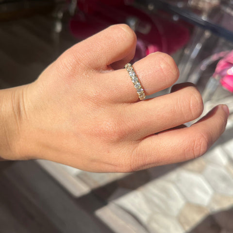 Elegant 1.17ctw Old European Cut Diamond Half-Eternity Yin-Yang Band, romantic design with Old European Cut Diamonds, Earth-mined diamonds in platinum and 18kt yellow gold shown on ring finger