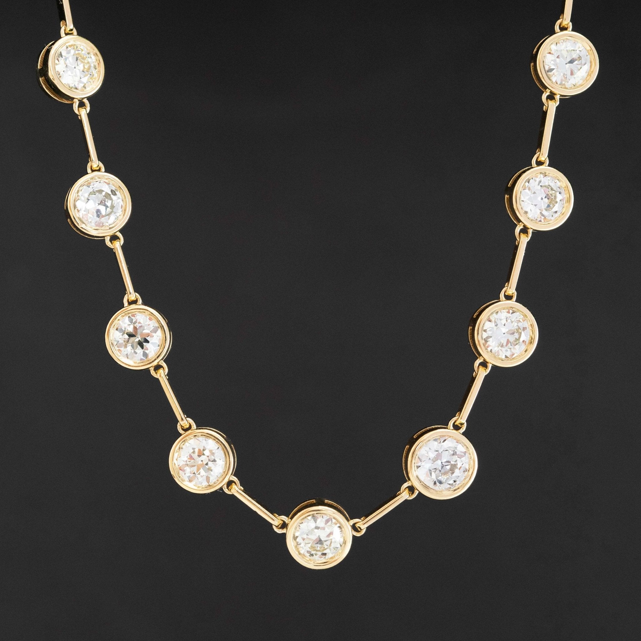 Old European cut diamond bezel riviere necklace in 18k yellow gold, 12.15 carats total weight