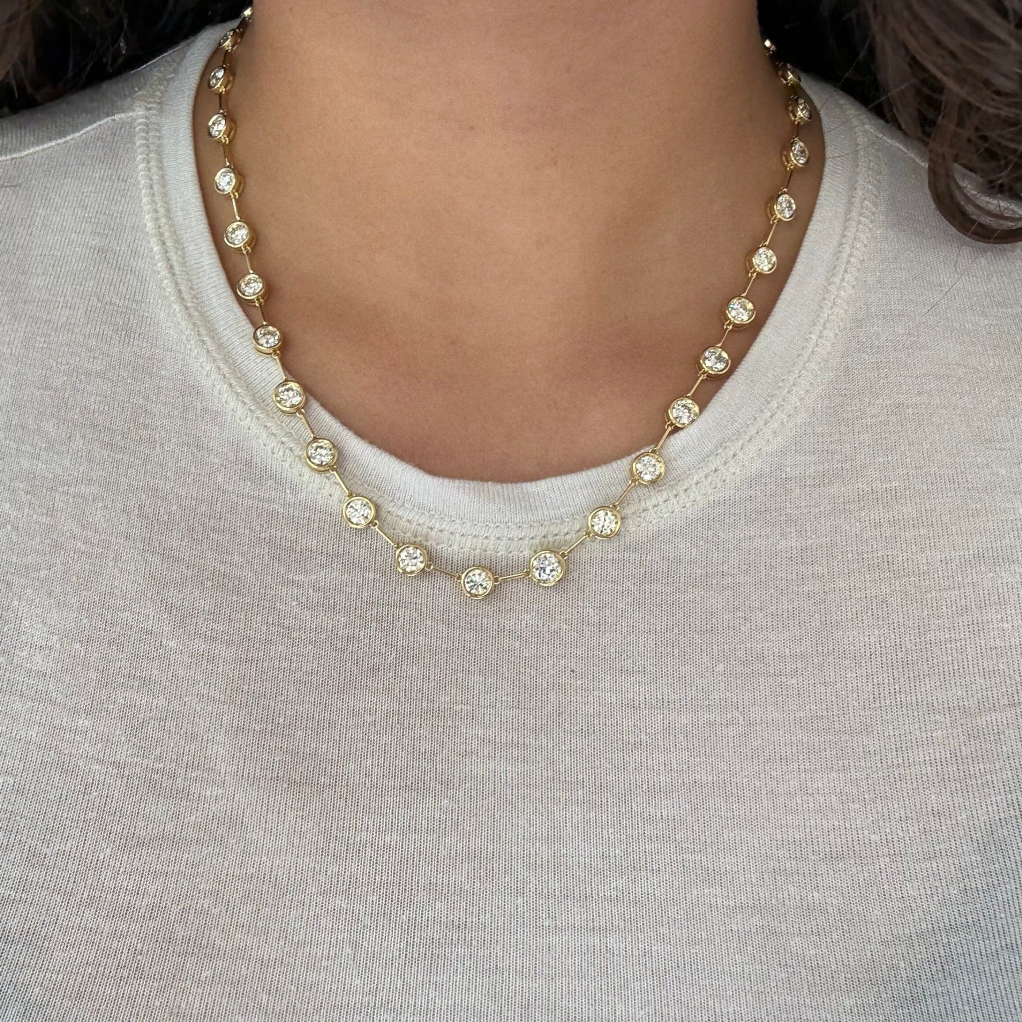 Vintage-inspired diamond riviere necklace with bezel settings and OEC diamonds