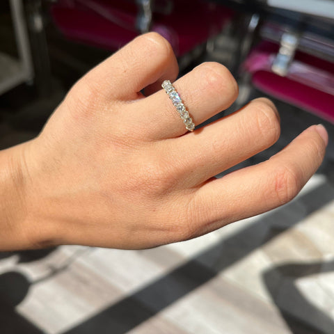 Elegant 1.23ctw Old Mine Cut Diamond Half-Hoop Band, romantic design with Old Mine Cut Diamonds, Earth-mined diamonds in yellow gold shown on ring finger
