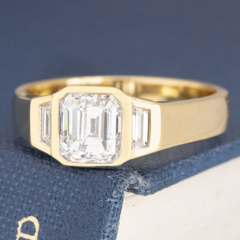 1.31ctw Emerald Cut Diamond Bezel Trilogy Ring