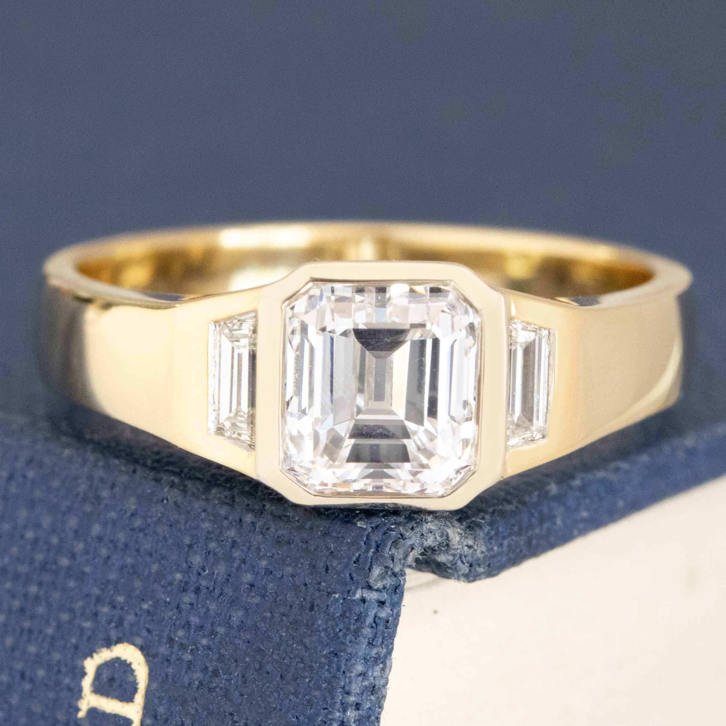 1.31ctw Emerald Cut Diamond Bezel Trilogy Ring