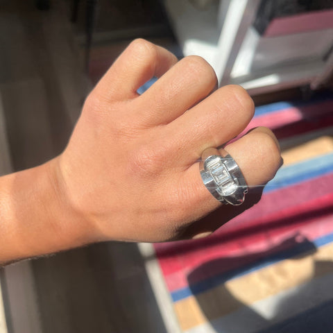 Bold geometric tank ring in platinum with 1.35ctw step-cut diamonds, shown on the finger