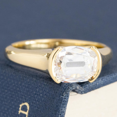 1.50ct GIA E SI2 elongated cushion cut diamond east-west half-bezel solitaire, 18K yellow gold – alternate view 3