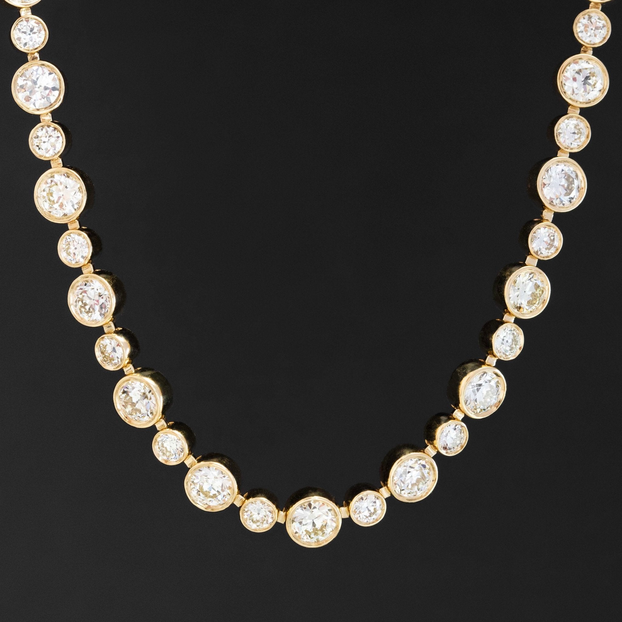 Bezel-set Old European cut diamond necklace in 18k yellow gold with 15ctw recycled diamonds.