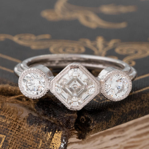 1.61ctw asscher cut diamond trilogy ring, GIA I VVS2 center with round brilliant sides, platinum