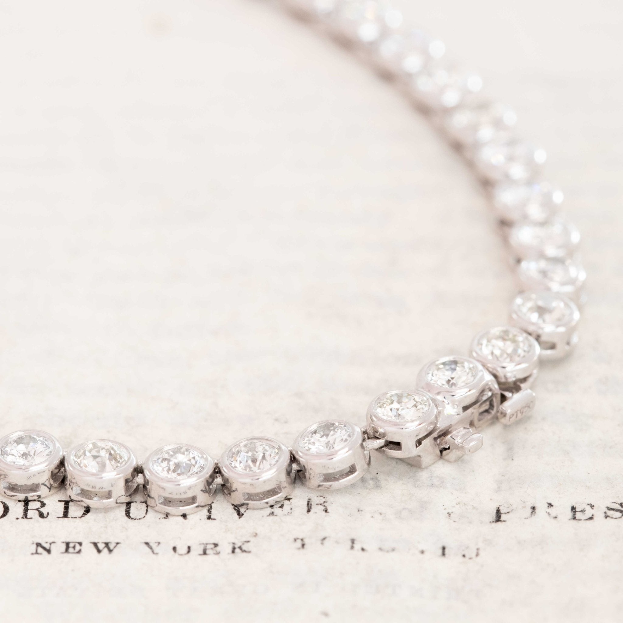 Close-up of recycled Old European cut diamonds in platinum bezel settings