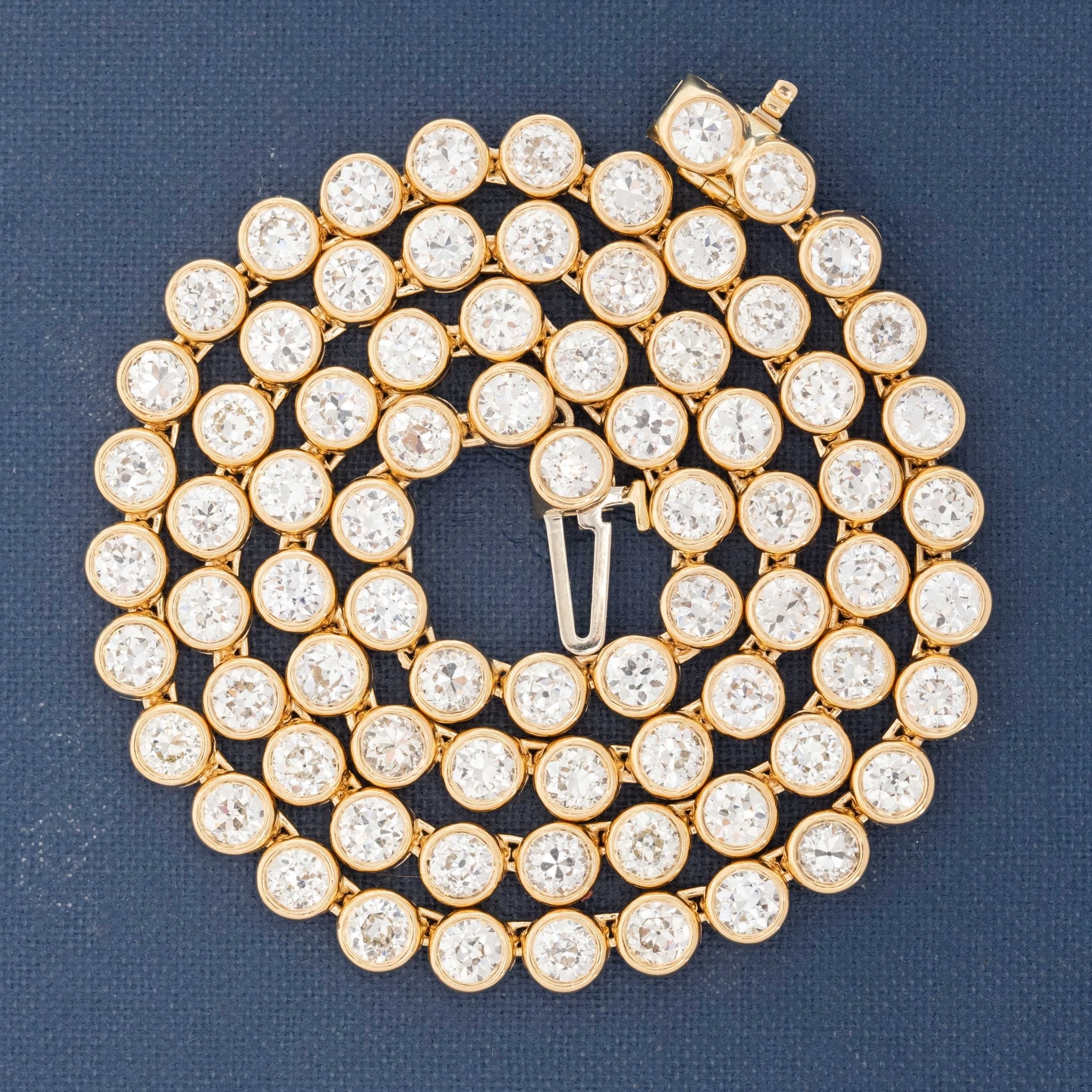 Detail of 18kt yellow gold bezels showcasing antique diamond faceting