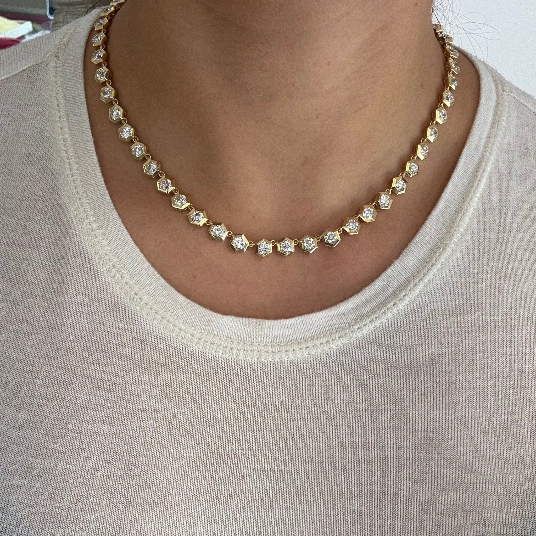 Full view of antique diamond tennis necklace displayed on model