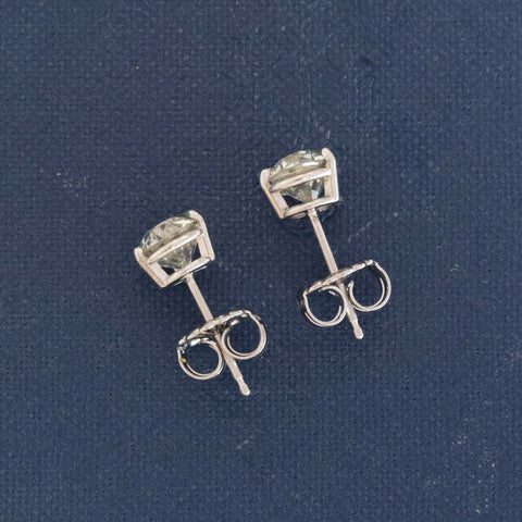 profile of vintage diamond stud earrings platinum GIA certified old european cut
