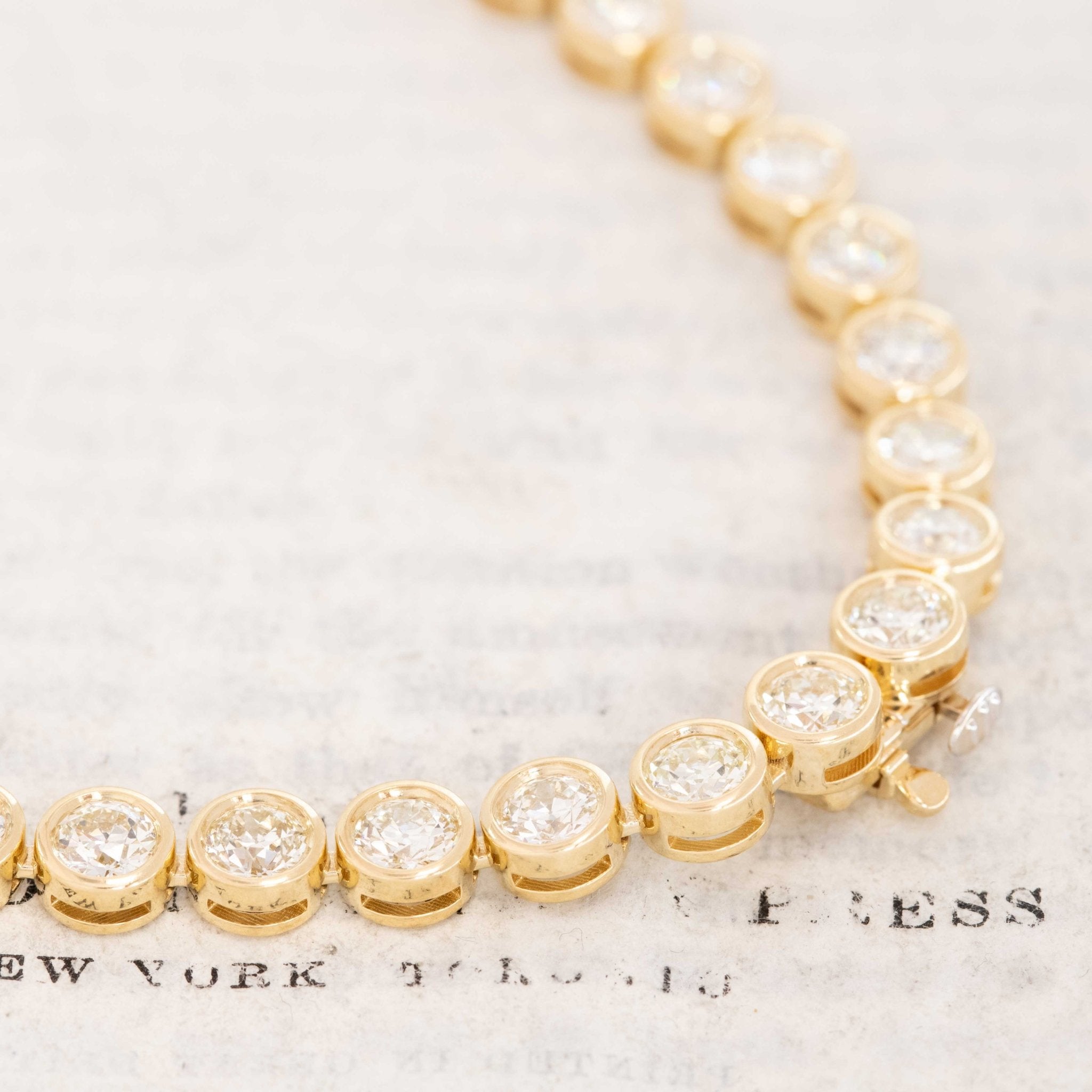 Clasp detail of 18.66ctw antique diamond rivière necklace with vintage old-cut diamonds in yellow gold, handcrafted in Los Angeles