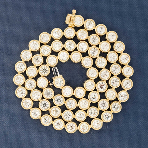 Close-up of 18.66ctw old-cut vintage diamonds set in a handcrafted yellow gold rivière necklace made in Los Angeles.