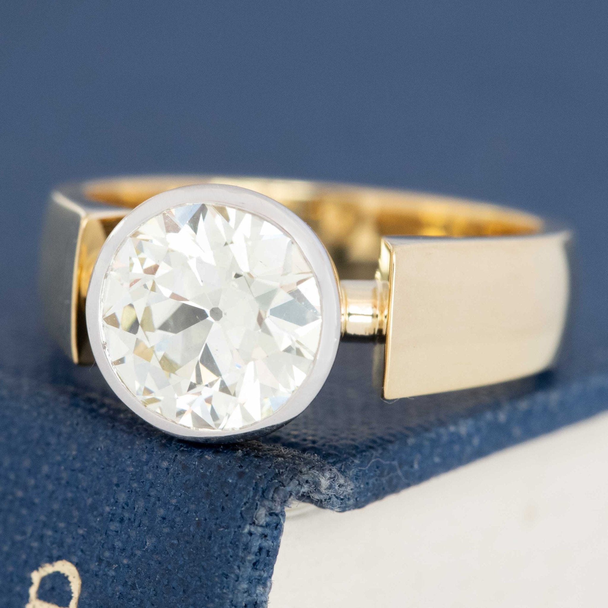 Close-up of vintage yellow gold bezel ring with old European cut diamond