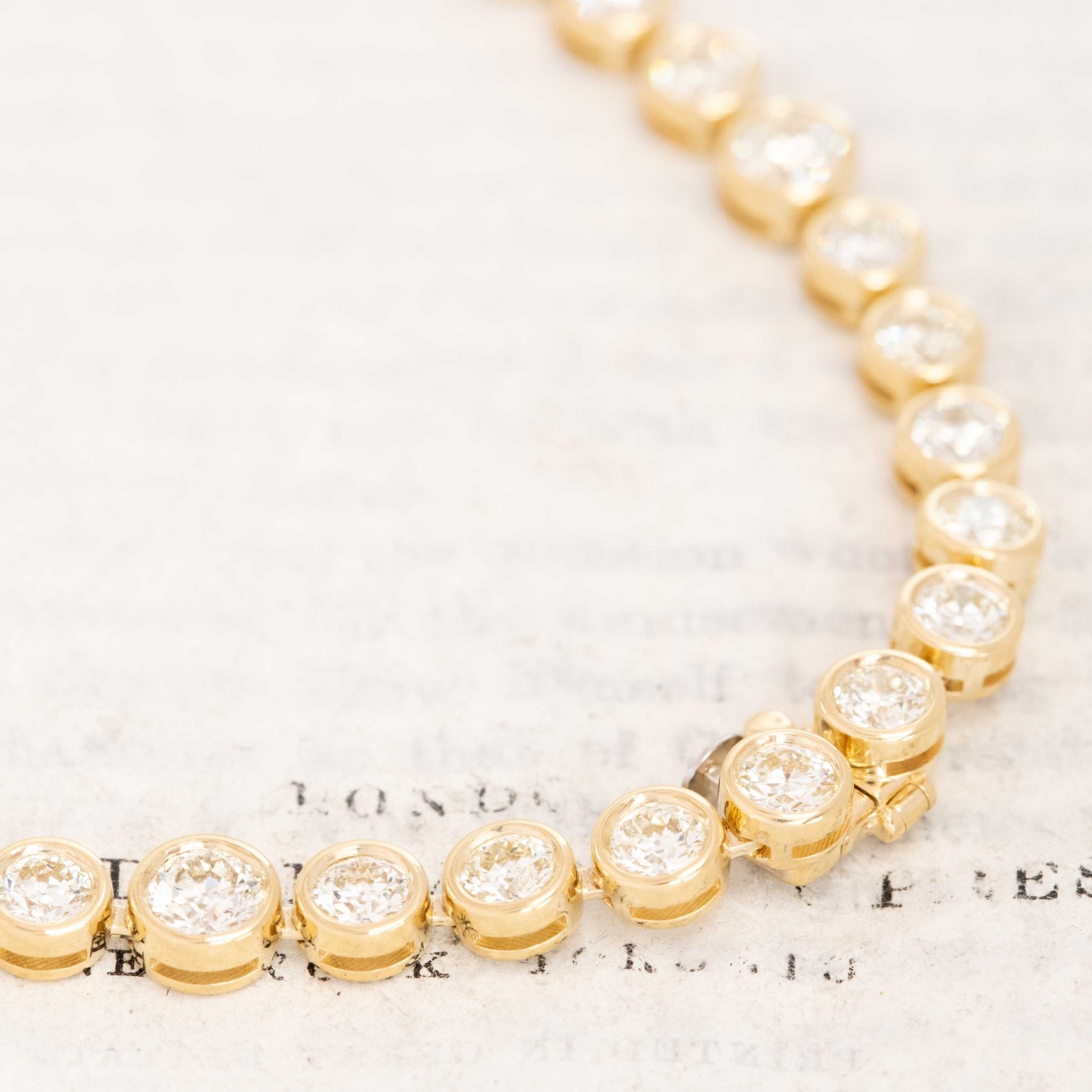 Close-up of Old European Cut Diamond Graduated Bezel Tennis Necklace in 18kt Yellow Gold