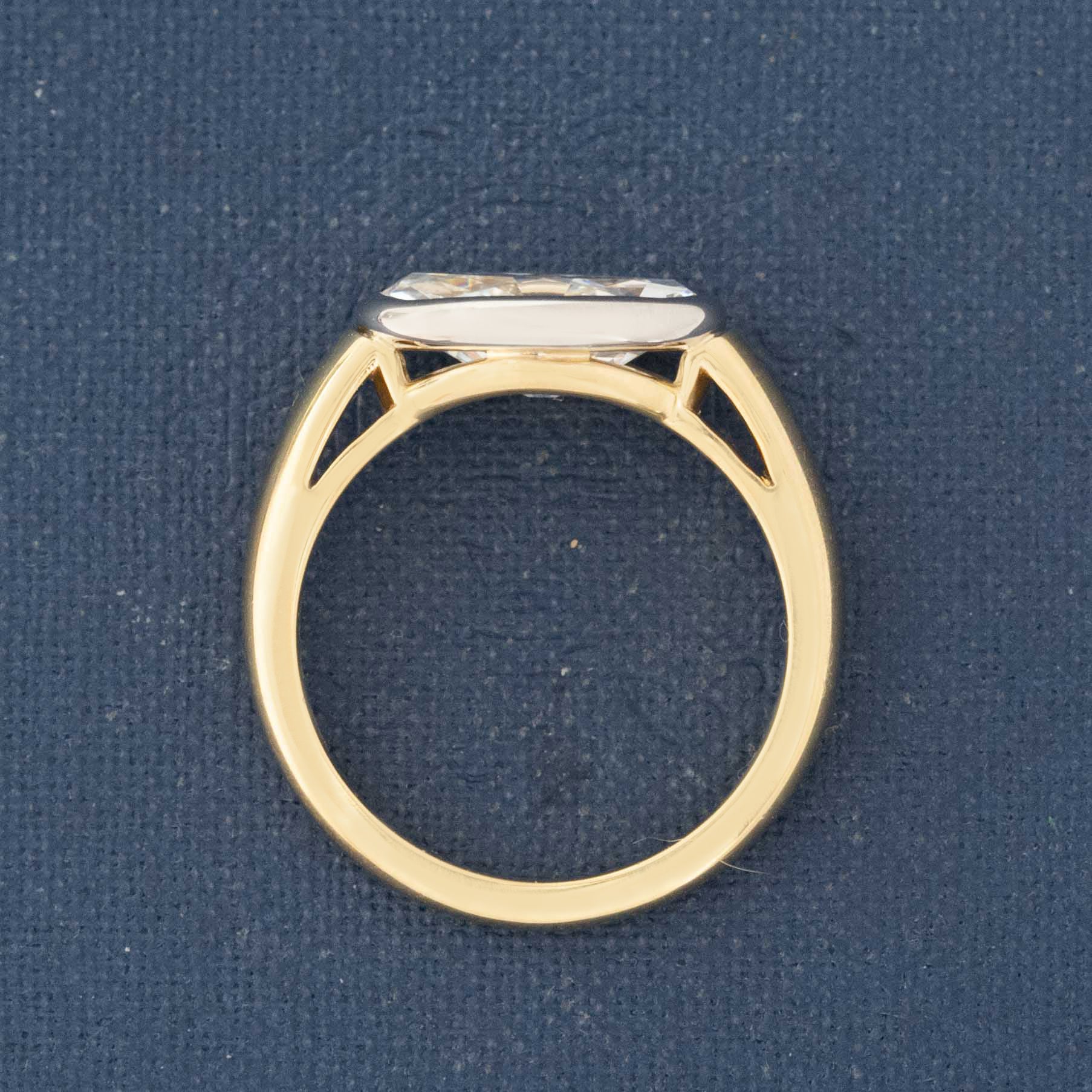 Modern moval cut diamond solitaire bezel ring