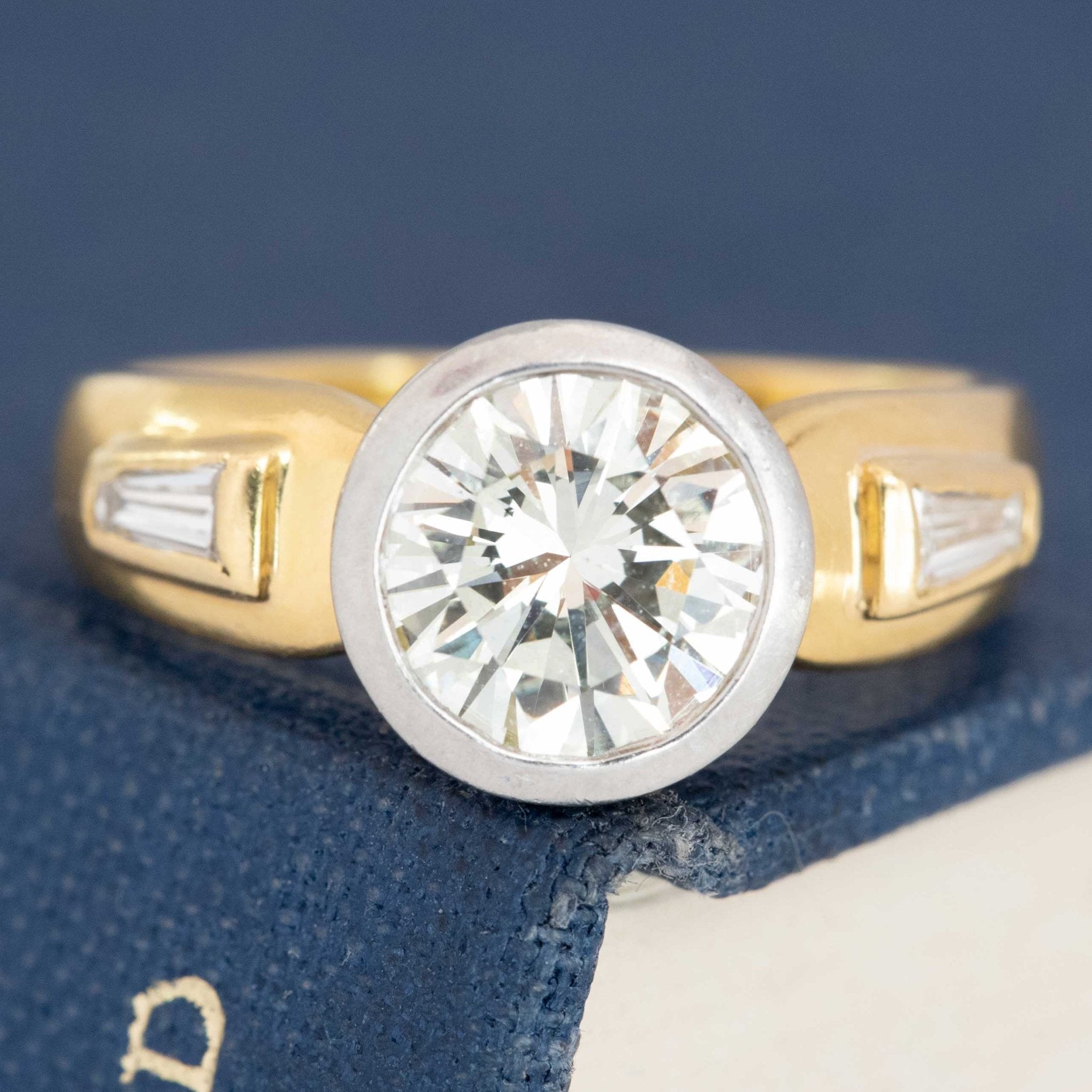 Two-tone gold vintage wedding rings with round diamond center