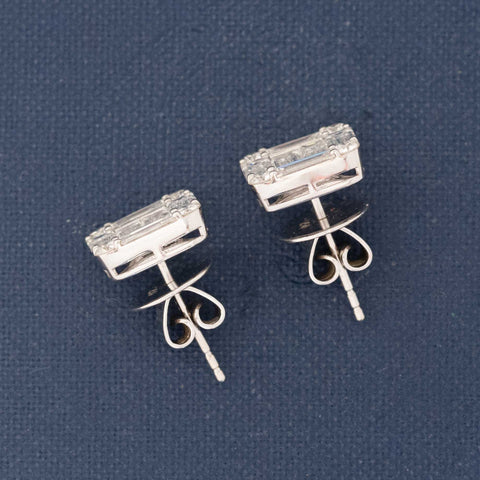 profile view of diamond illusion studs in white gold