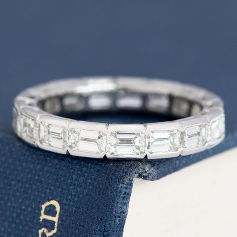 2.53ctw emerald cut diamond half bezel eternity band in platinum