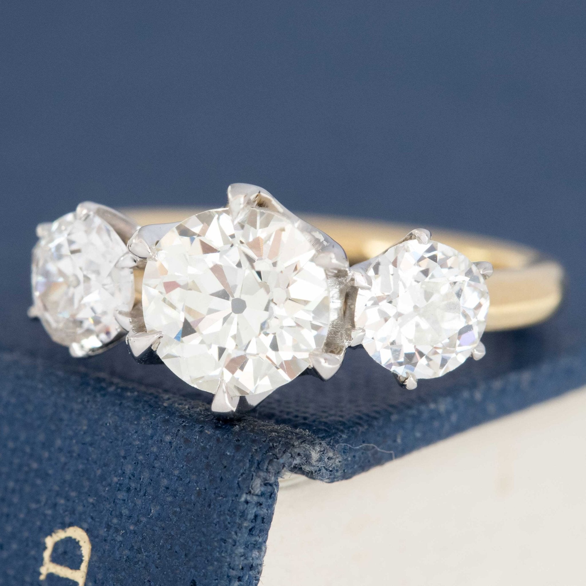 Old European cut diamond engagement ring with side stones