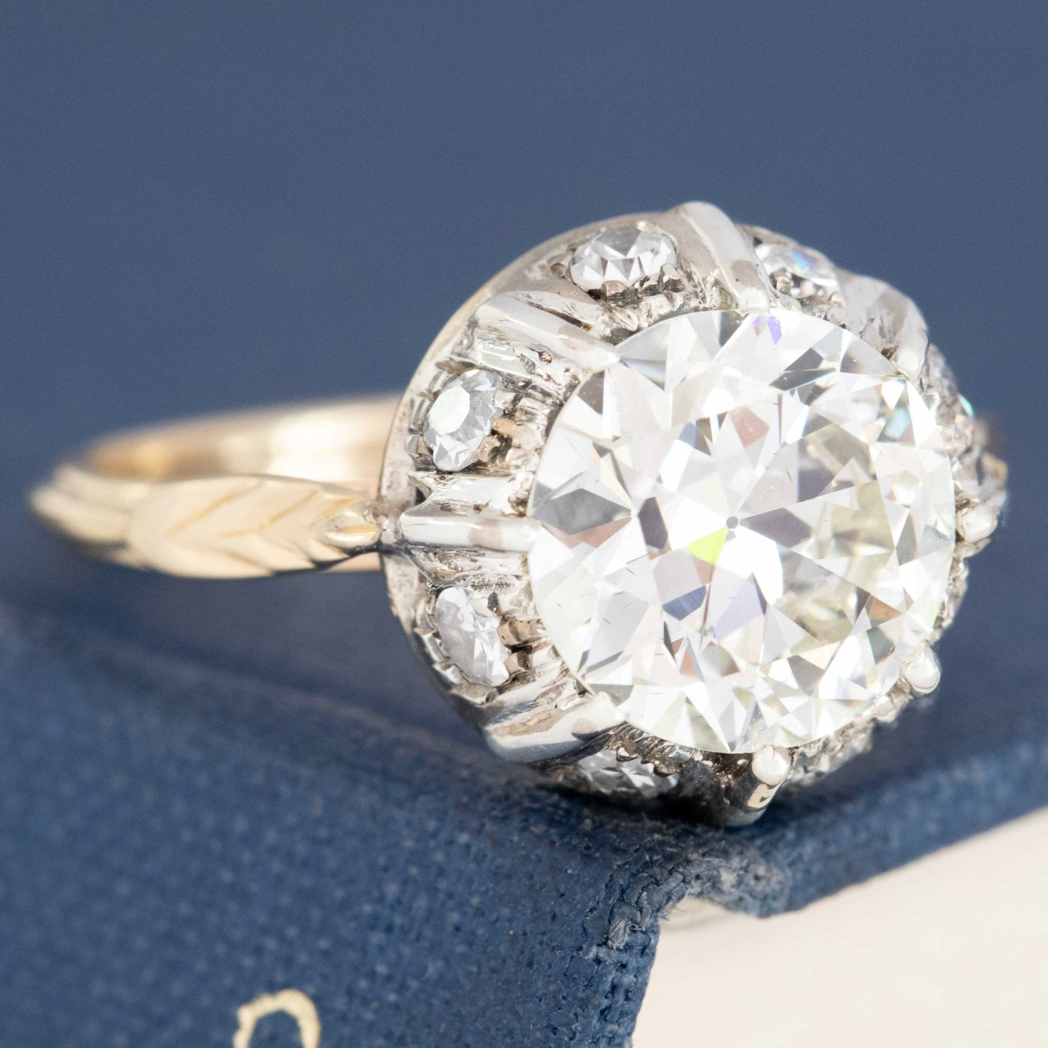 Old European cut diamond ring with classic gold collet setting