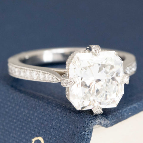 Sparkly radiant cut diamond ring combining old and new design.