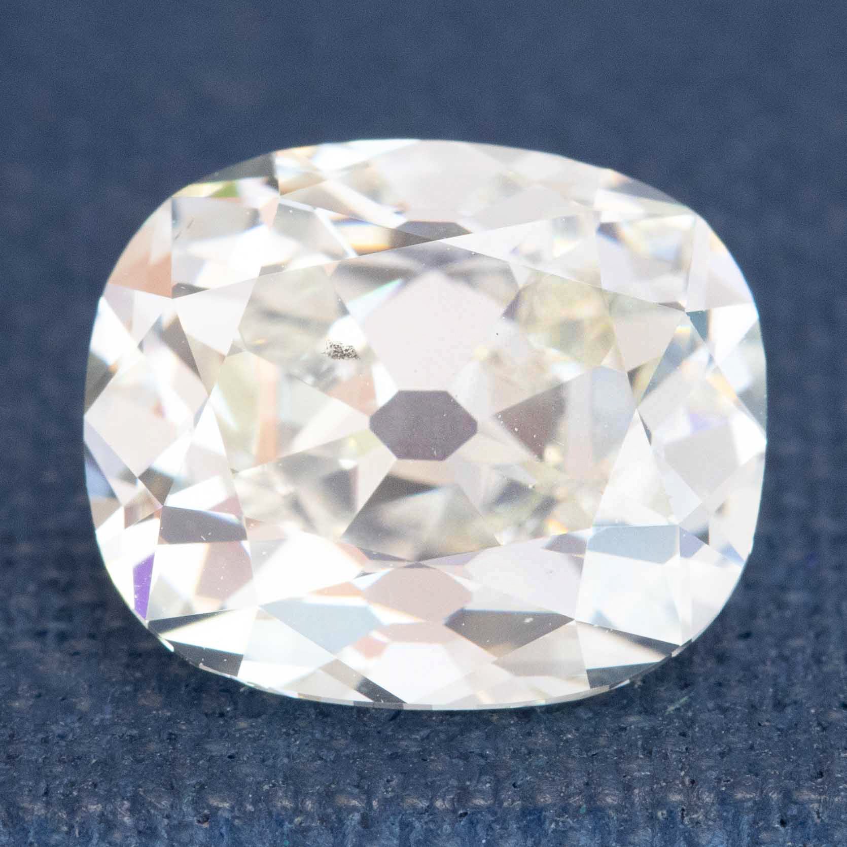 GIA certified antique diamond in K color SI1 clarity

Vintage Old Mine Cut elongated diamond, white-facing brilliance