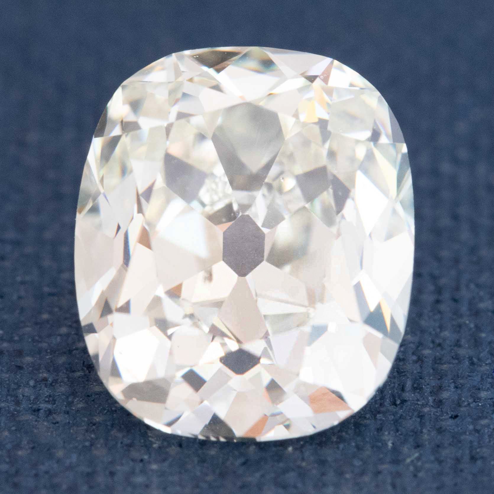 Antique elongated Old Mine Cut diamond with chunky facets

Elongated OMC diamond showing Maltese cross and open culet