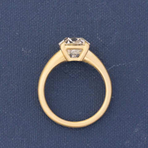 Side profile of Vintage-inspired four-prong Old Mine Cut diamond ring.