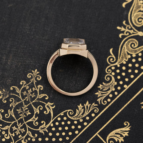 Functional diamond locket ring in matte yellow gold, engravable surface.
