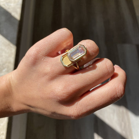 One-of-a-kind 18kt gold diamond locket ring designed by Jewels by Grace shown on ring finger