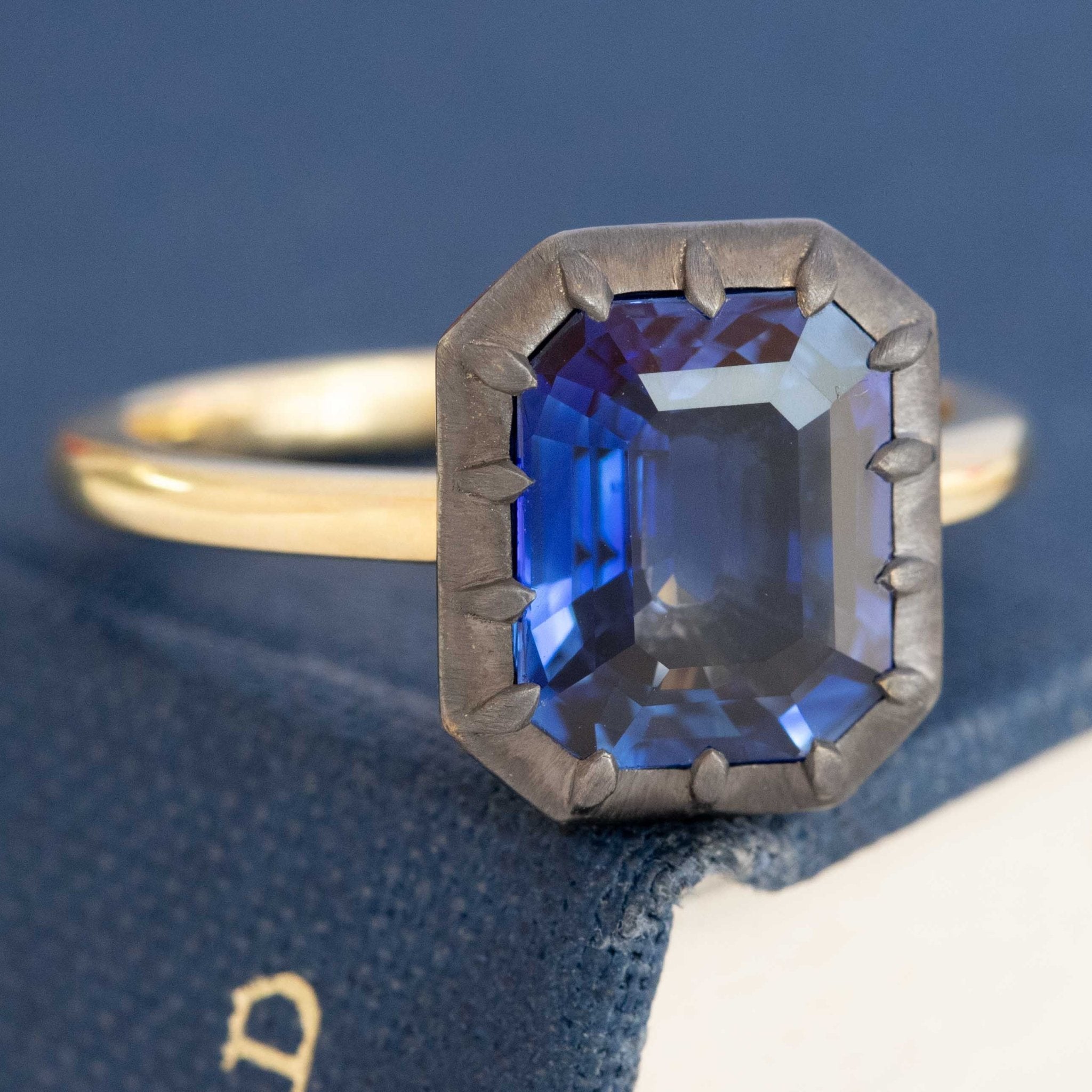 Profile — antique-finish collet sapphire ring, GIA certified
