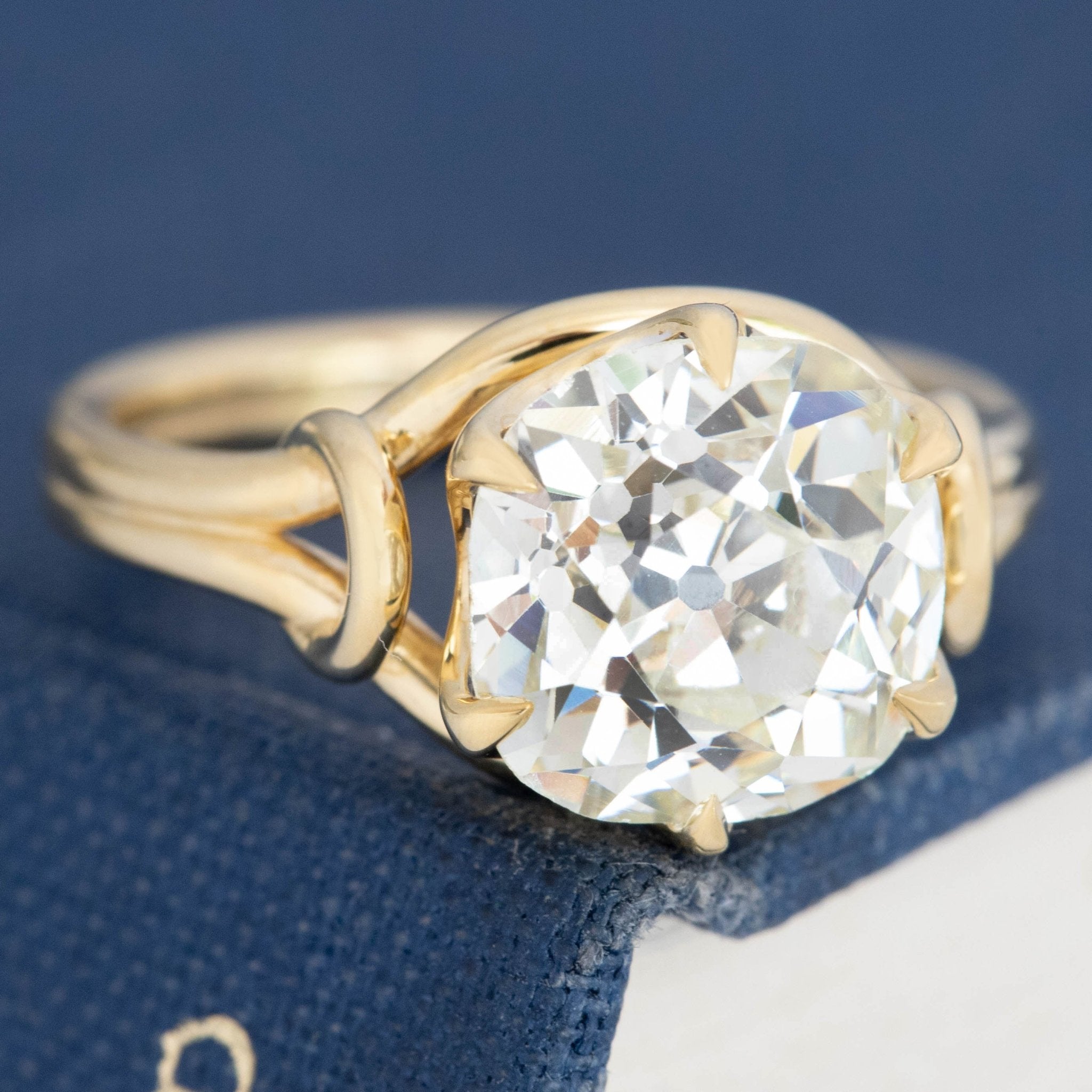 antique old mine cut diamond ring with sculptural gold prongs