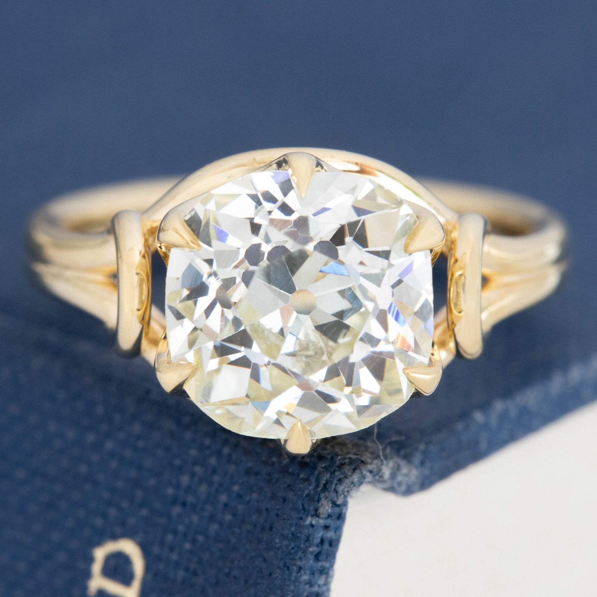 3.46ct old mine cut diamond ring in yellow gold claw setting