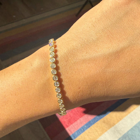 Antique diamond tennis bracelet sparkling in natural light