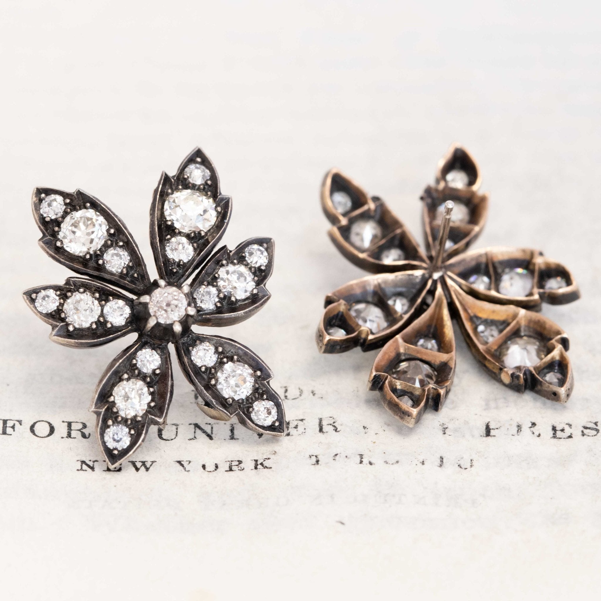 Old-mine cut diamond flower drop earrings close-up