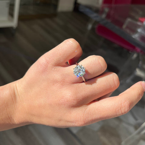 Classic platinum solitaire featuring a 4.03ct Old European diamond shown on ring finger