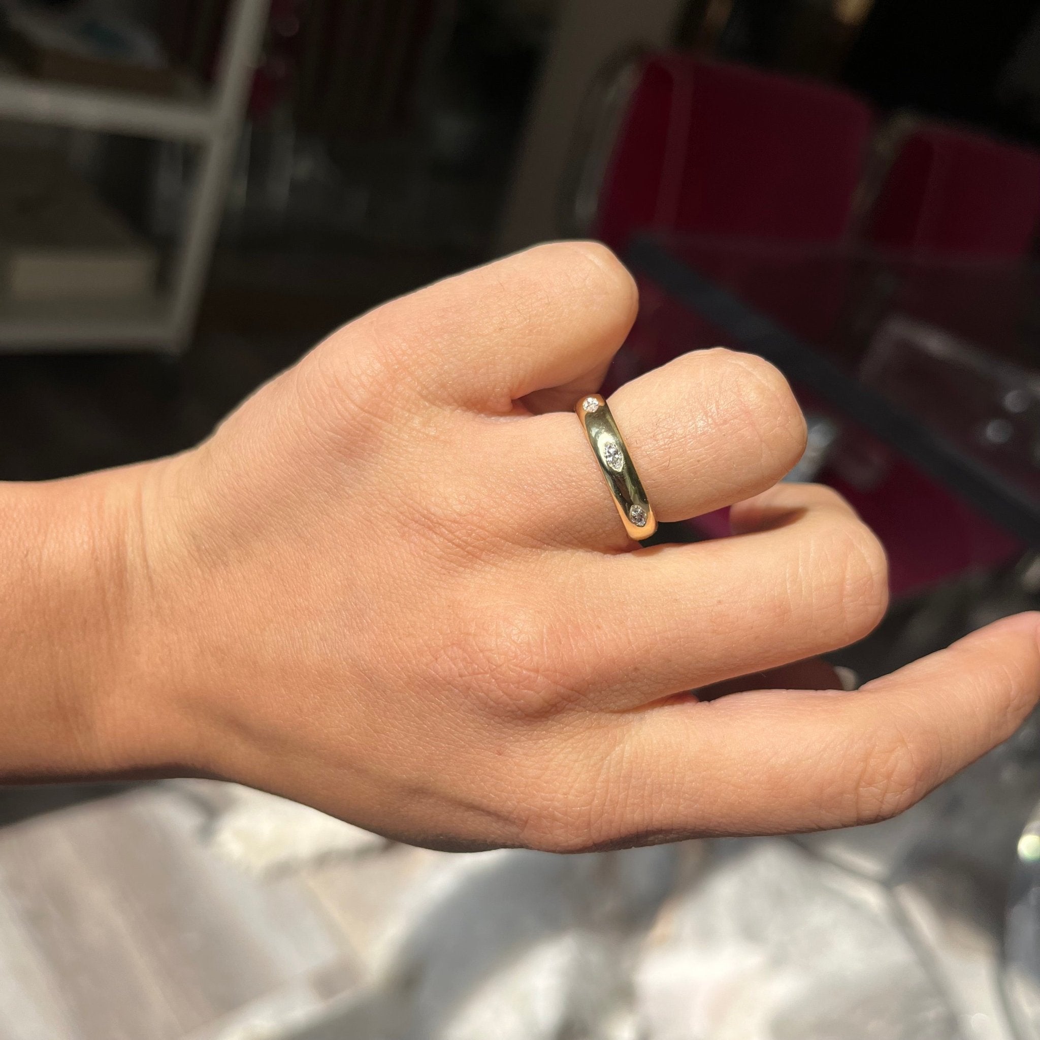 Elegant .44ctw Vintage Marquise Cut Diamond Eternity Band, romantic design with Antique Diamonds, Earth-mined diamonds in yellow gold shown on ring finger.