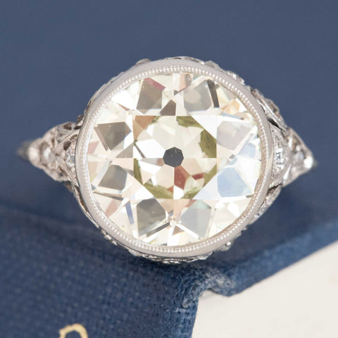 4.76ct Edwardian Old European Cut Diamond bezel solitaire in platinum and white gold.