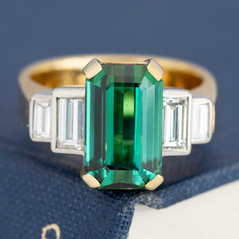 4.92ct vintage tourmaline ring with .60ctw baguette cut diamond shoulders, 18K yellow gold