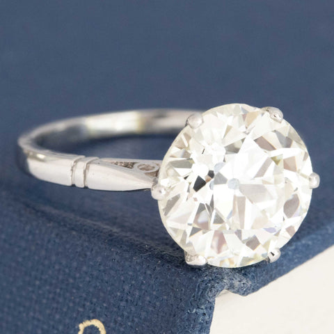 Classic vintage OEC diamond solitaire with timeless platinum design.