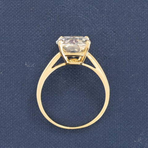 Side profile of bright and prismatic elongated cushion cut diamond ring.
