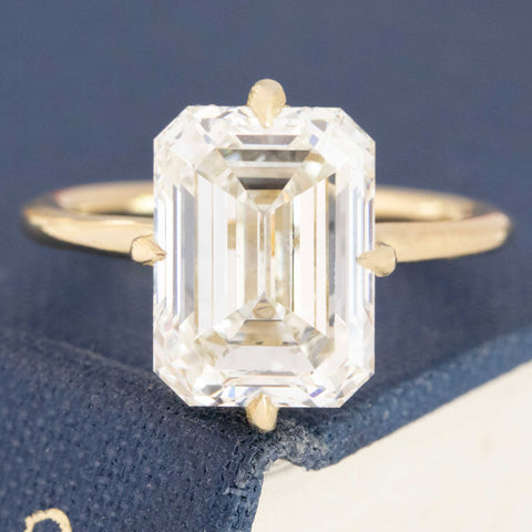 Timeless emerald cut engagement ring with step cut diamond.
