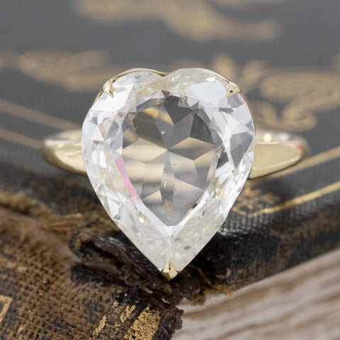 GIA certified rose cut diamond ring with minimal prong yellow gold setting.